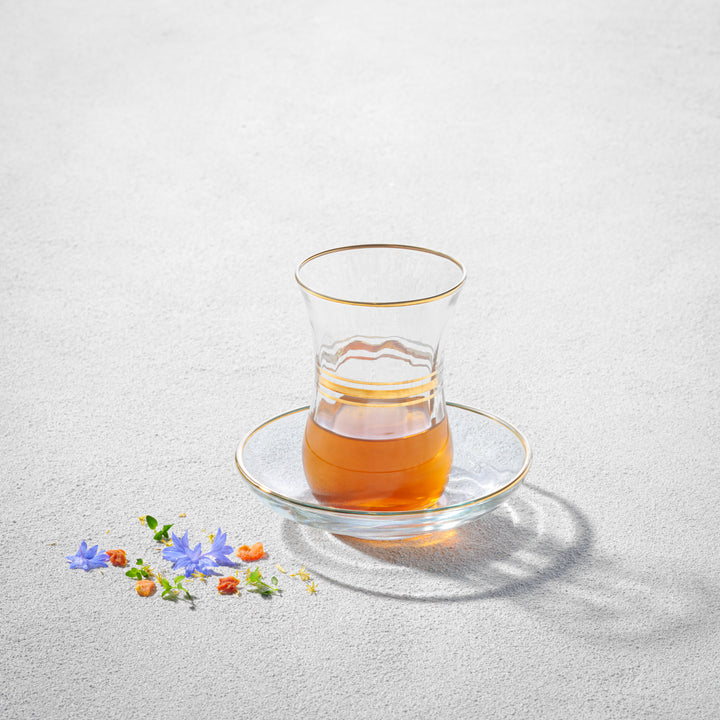 Cays, Glass Teacup and Saucer with Gold Rim